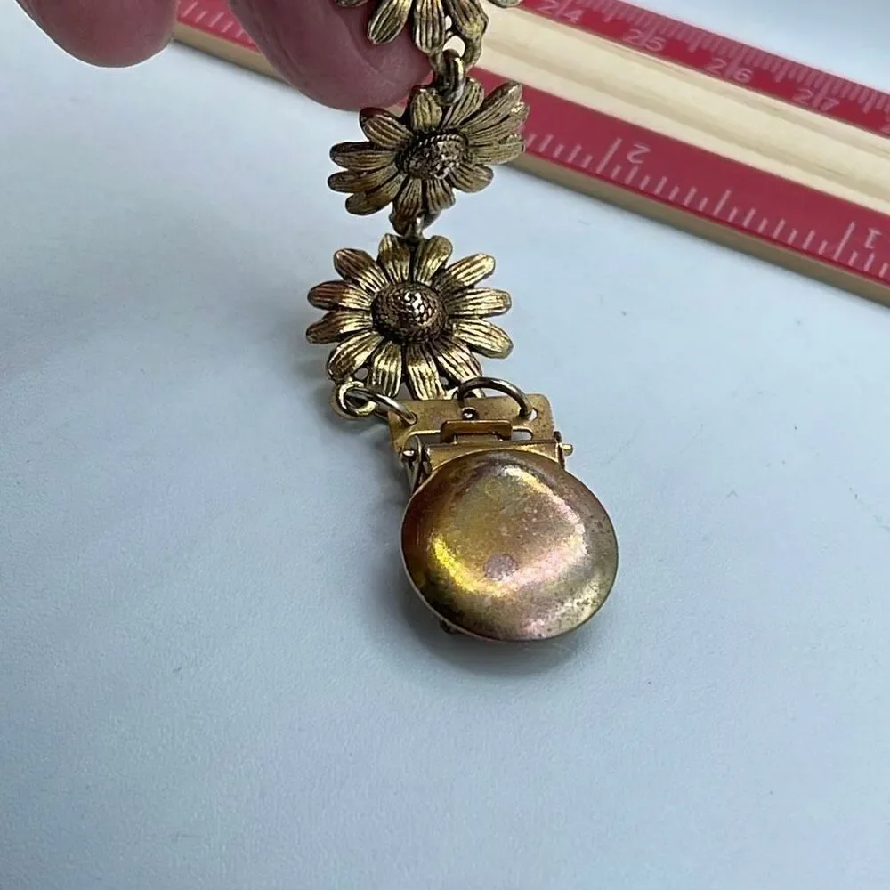 Vintage sunflower cape sweater clip.